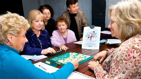 adults playing scrabble