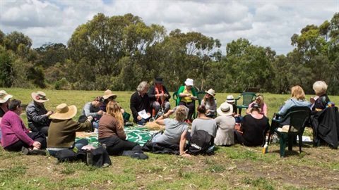 A small crowd meeting in a park for Conservation group