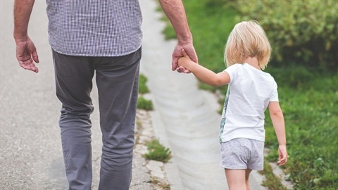 Father and child walking