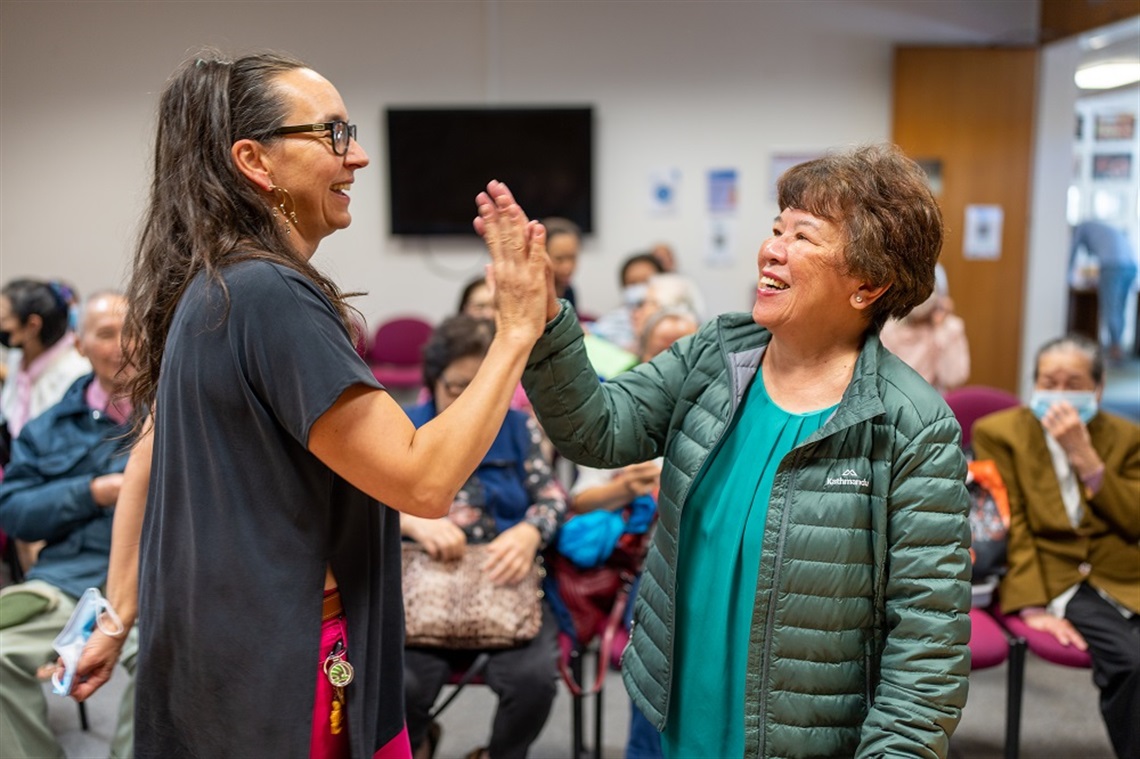 darebin-grants-two-people-high-fiving.jpg
