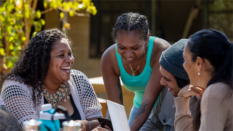 four women laughing