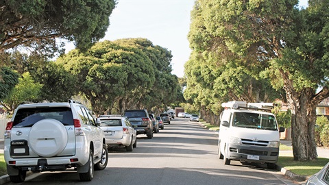 Cars and a van parked on a Darebin street