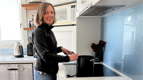Helen cooking on an induction stove