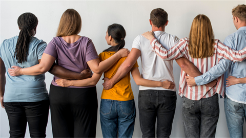 people standing together linking arms