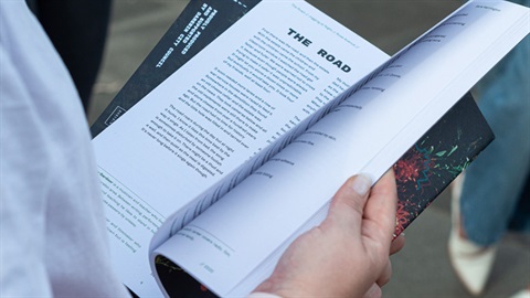 Person flicking through the pages of a book