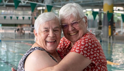 rlc ladies hugging near the pool