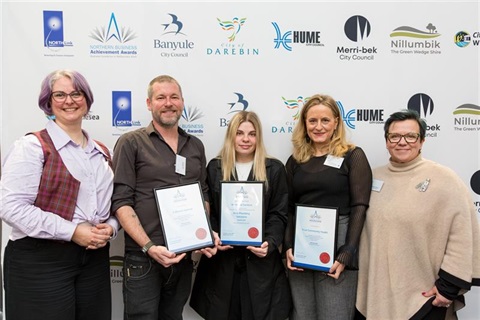 Image of people holding certificates 