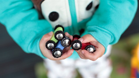 childs hands with toys