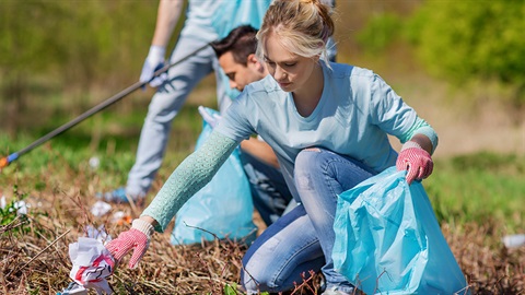 People collecting rubbish in a park