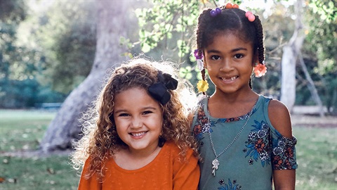 Two girls outside a community centre