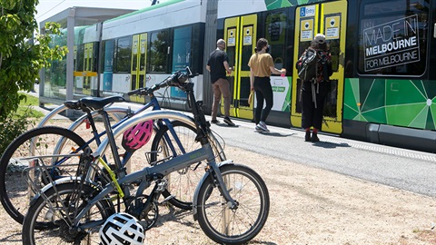 Bikes parked next to trams