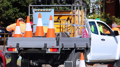 Construction ute parked on road