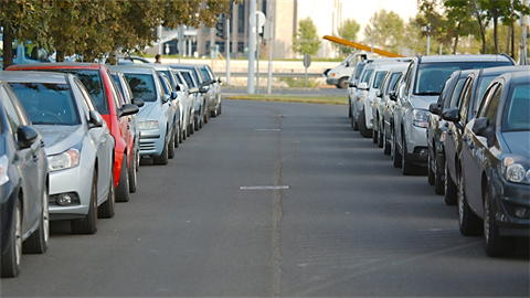 Photo of cars parked on a street