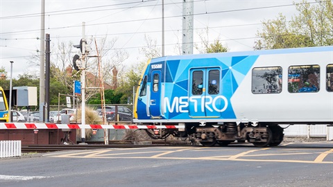 Train at level crossing