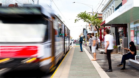 Tram arriving at tram stop in High Street Northcote