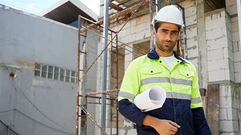 Builder at a house construction site