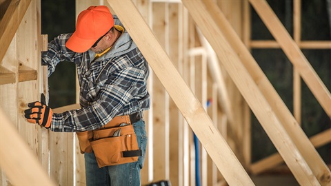 Builder on a housing site construction