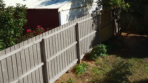 Wooden fence between two properties