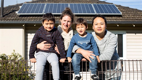 Family of 4 with solar panels on their house