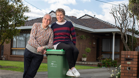 a photo of a couple with the green bin