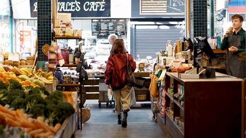 Woman browsing through Preston Market