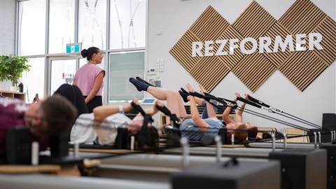 People on reformer pilates machines at  Reservoir Leisure Centre. 